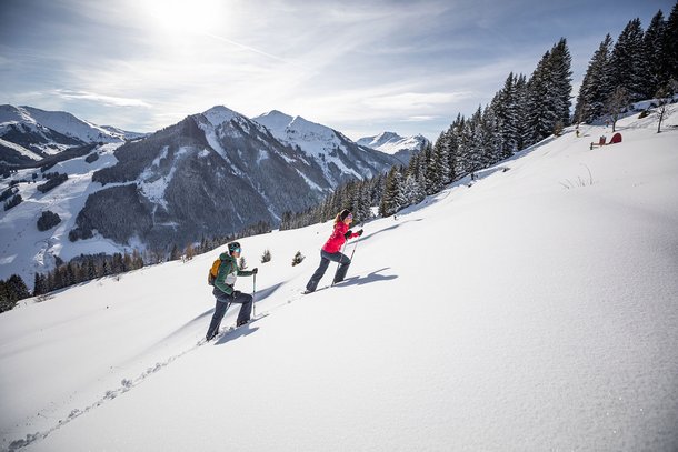 Couple snow-shoe hiking