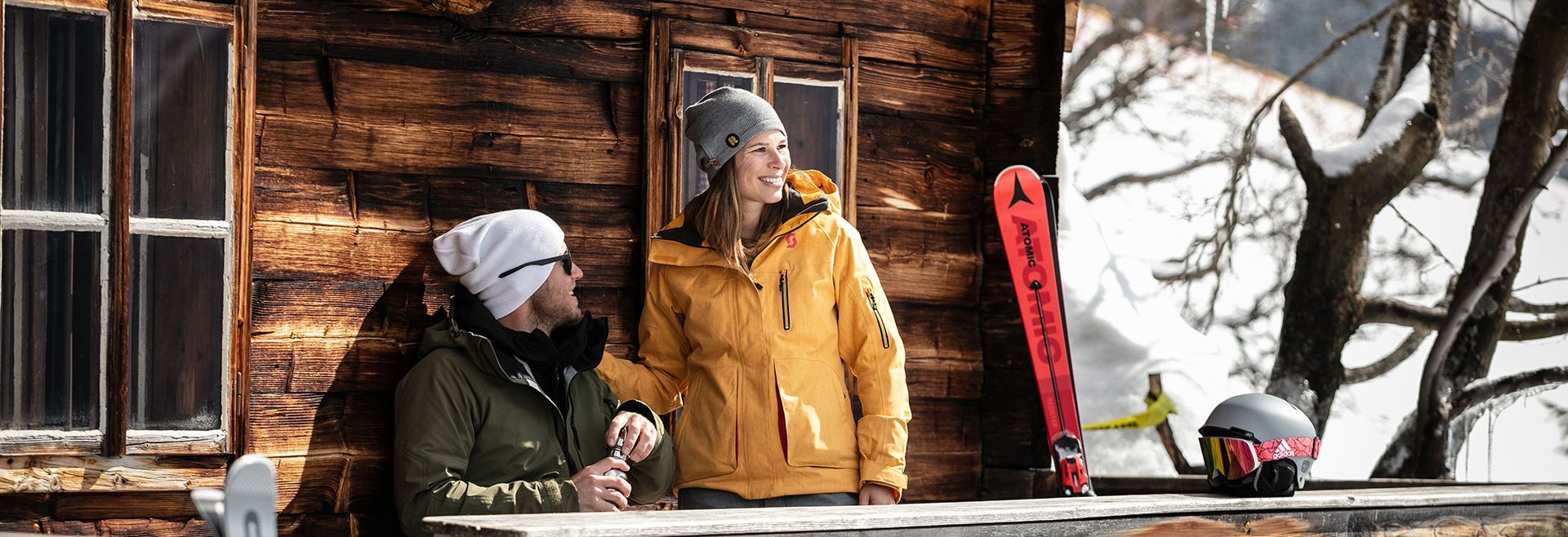 Skiers taking a rest at a mountain hut